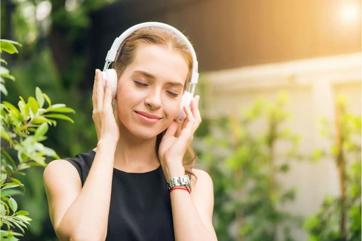 Teen practicing self-care with headphones, enjoying music and relaxation