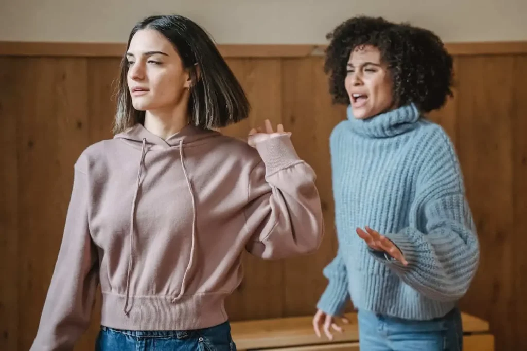 Image of two teenagers in a heated disagreement, highlighting the importance of conflict resolution activities for teens