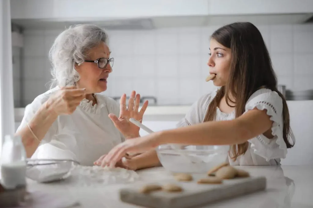 A mother is engaging her teenage girl in a conversation and explaining something to her politely