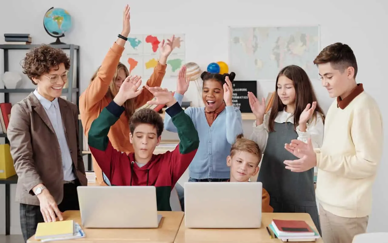 Teens performing communication activities in the classroom with fun and enthusiasm