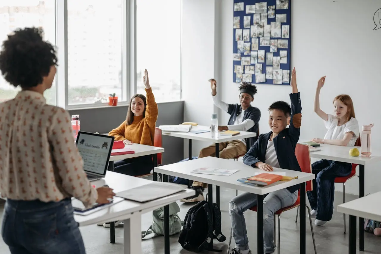 Teacher asking morning meeting questions and students answering in the classroom