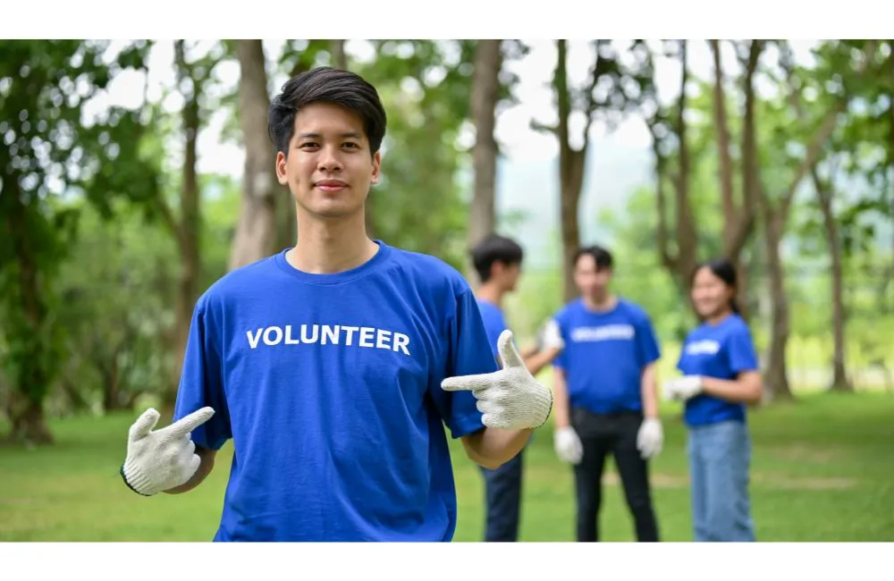 A happy young boy participating in volunteer work 